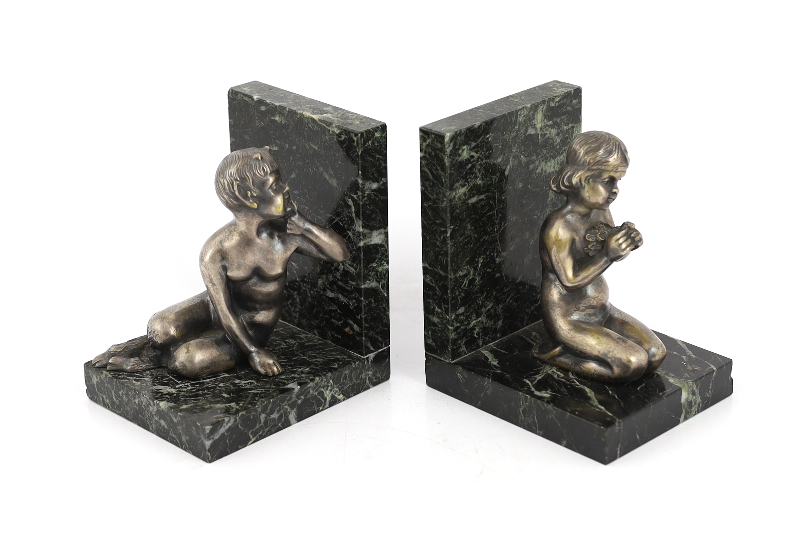 Henri Fugère, a pair of silvered bronze and marble bookends modelled as a kneeling faun and girl holding a posy of flowers, 11cm wide, 9cm deep, 13cm high